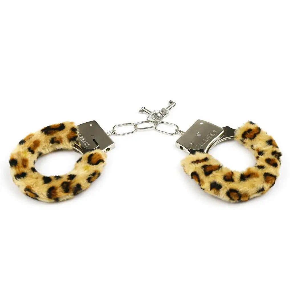 Leopard furry handcuffs on a white background